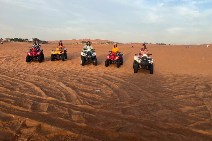 Rev up your adventure on the golden sands of Dubai! Experience the thrill of quad biking as you navigate the dunes surrounded by stunning desert vistas and endless skies.